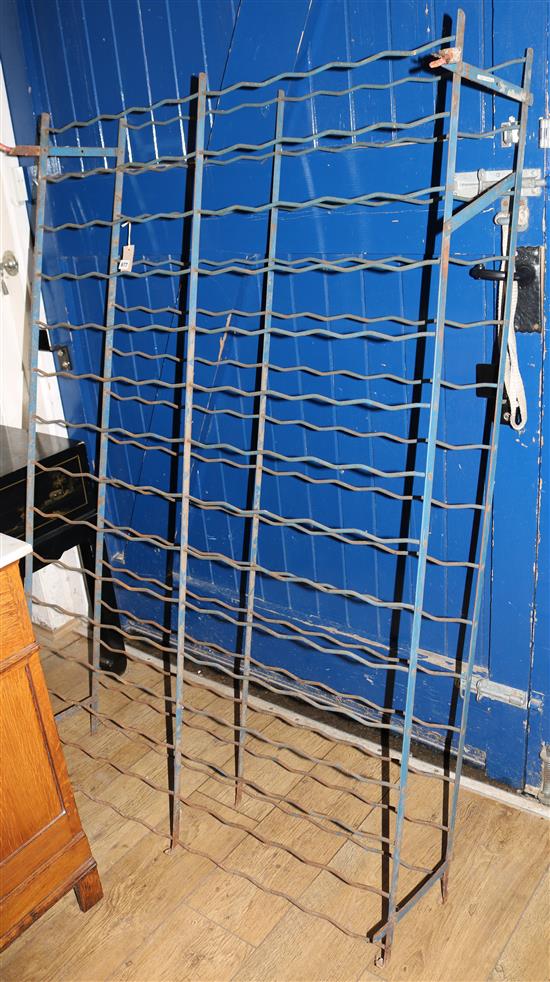 A wrought iron wine rack, W.101cm H.155cm